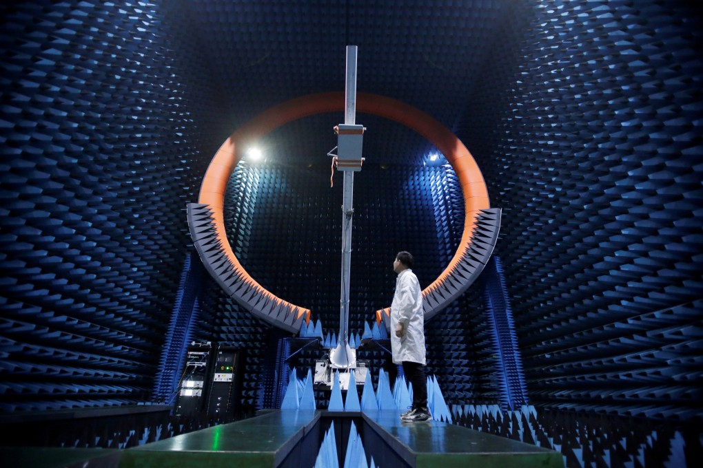 A Huawei engineer inspects the 5G base station antenna in the testing system at Huawei’s Songshan Lake Manufacturing Centre in Dongguan, Guangdong province, on May 30. Photo: Reuters