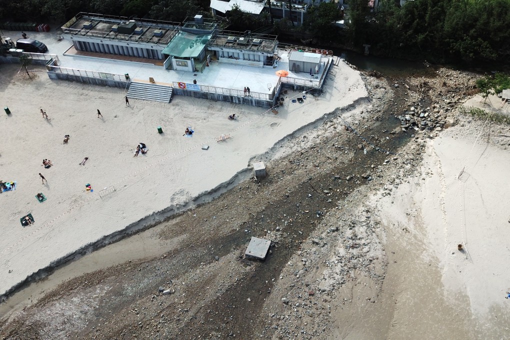 Big Wave Bay beach in Shek O on Thursday. The river broke its banks during heavy rain on Tuesday and drove a stream of rocks and debris to the sea. Photo: Antony Dickson