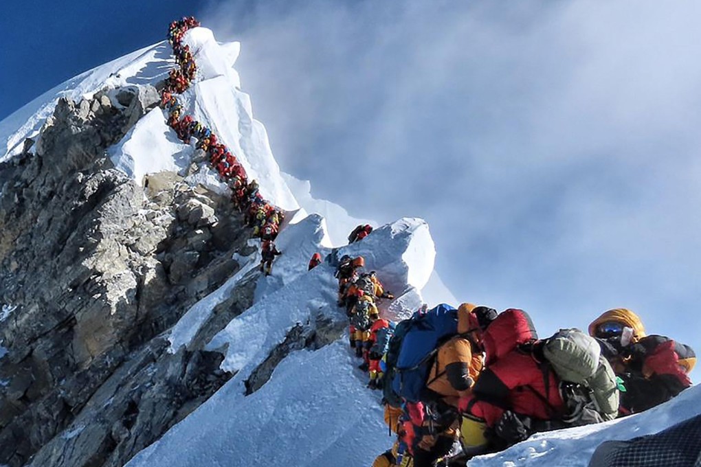 A viral picture causes outrage as climbers queue for the summit of Everest, but the Nepalese government say they will not restrict permits. Photo: Project Possible
