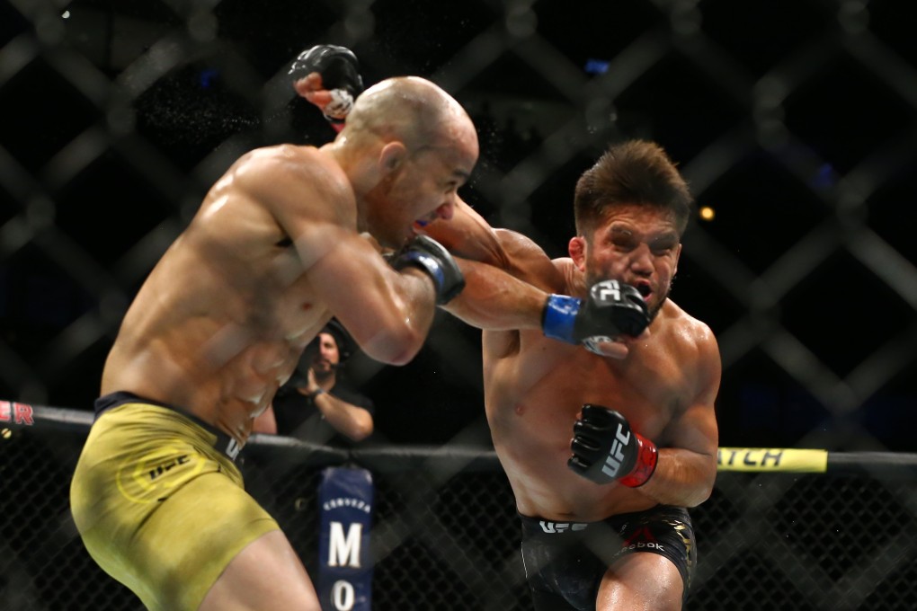 Marlon Moraes lands a shot on Henry Cejudo in their bantamweight championship bout at UFC 238. Photo: AFP