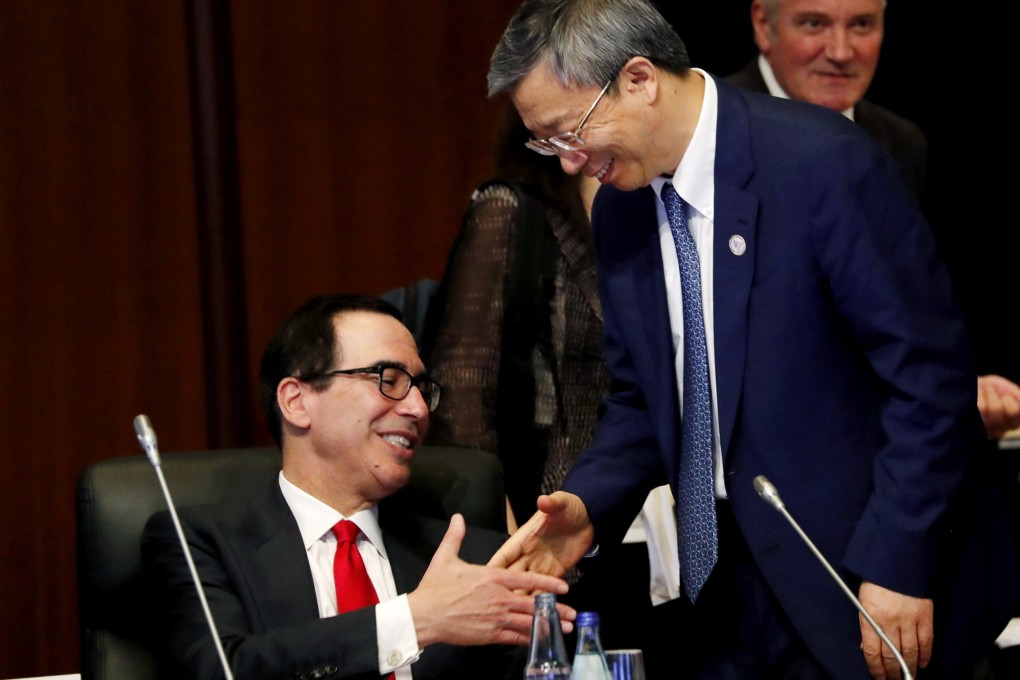 US Treasury Secretary Steven Mnuchin (left) shakes hands with Yi Gang, governor of the People's Bank of China during the G20 meeting in Fukuoka, Japan, on Saturday. Photo: Bloomberg