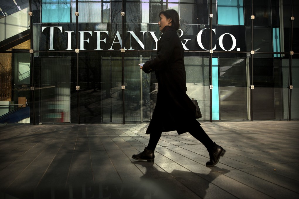 A woman walks past a Tiffany’s store at a shopping centre in Beijing. As global economic conditions worsen, China’s policymakers should encourage consumer spending. Photo: AP