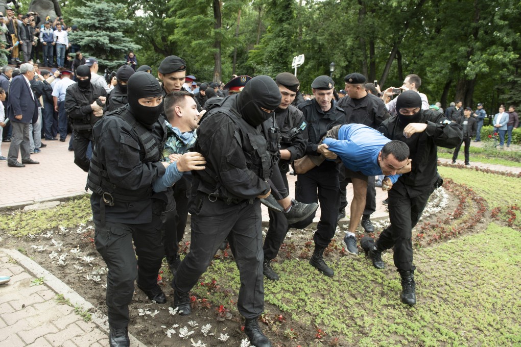 Kazakh police detain demonstrators in Almaty on Sunday. Photo: AP