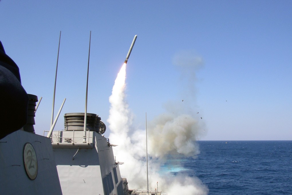 A US Navy guided missile destroyer launches a Tomahawk missile. File photo: AFP