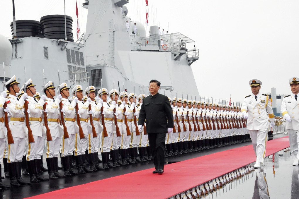 Chinese President Xi Jinping reviews an honour guards before a naval parade in Qingdao. Photo: Xinhua
