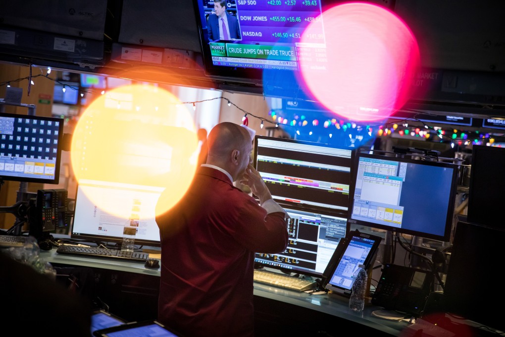 A trader works on the floor of the New York Stock Exchange. The US bond market is pricing on the assumption the US-China trade war will deliver a deflationary bust. Photo: Bloomberg