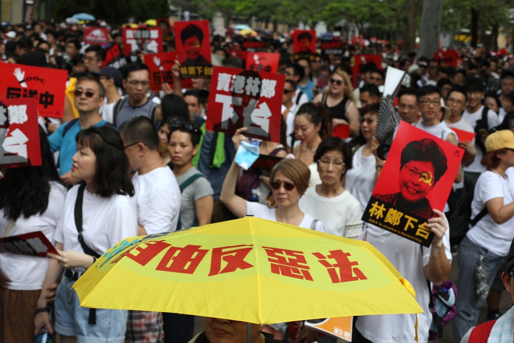 Hongkongers march from Causeway Bay to the government headquarters in Admiralty on June 9, in protest against the proposal to amend the city’s extradition laws to allow the transfer of fugitives to mainland China. The message on the yellow umbrella calls on the people to oppose the “evil law”. Photo: Xiaomei Chen