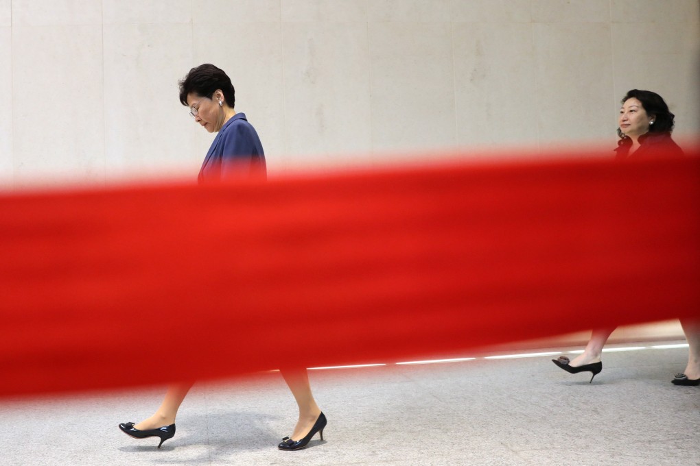 Hong Kong Chief Executive Carrie Lam and Secretary for Justice Teresa Cheng on their way to a media briefing a day after a massive protest against the extradition bill on Sunday. Photo: Sam Tsang