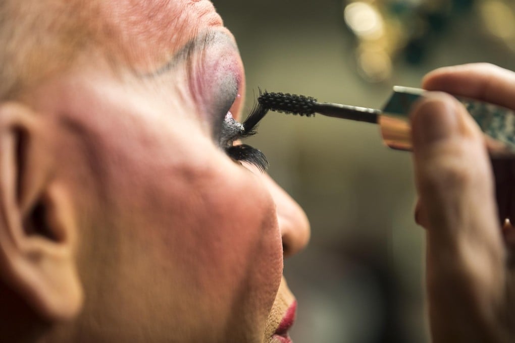 Charles Dillard, a legendary Atlanta drag performer, applies mascara in his dressing room before the start of a show at Lips in Atlanta. Photo: TNS