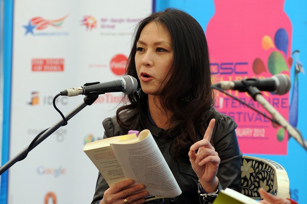 Amy Chua gestures as she reads an excerpt from her book during a literature festival in Jaipur, India in 2012. Photo: AFP