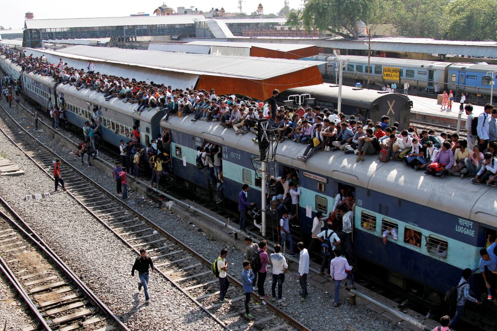 Passengers aboard an overcrowded train at a railway station in Ajmer in 2016. Photo: Reuters