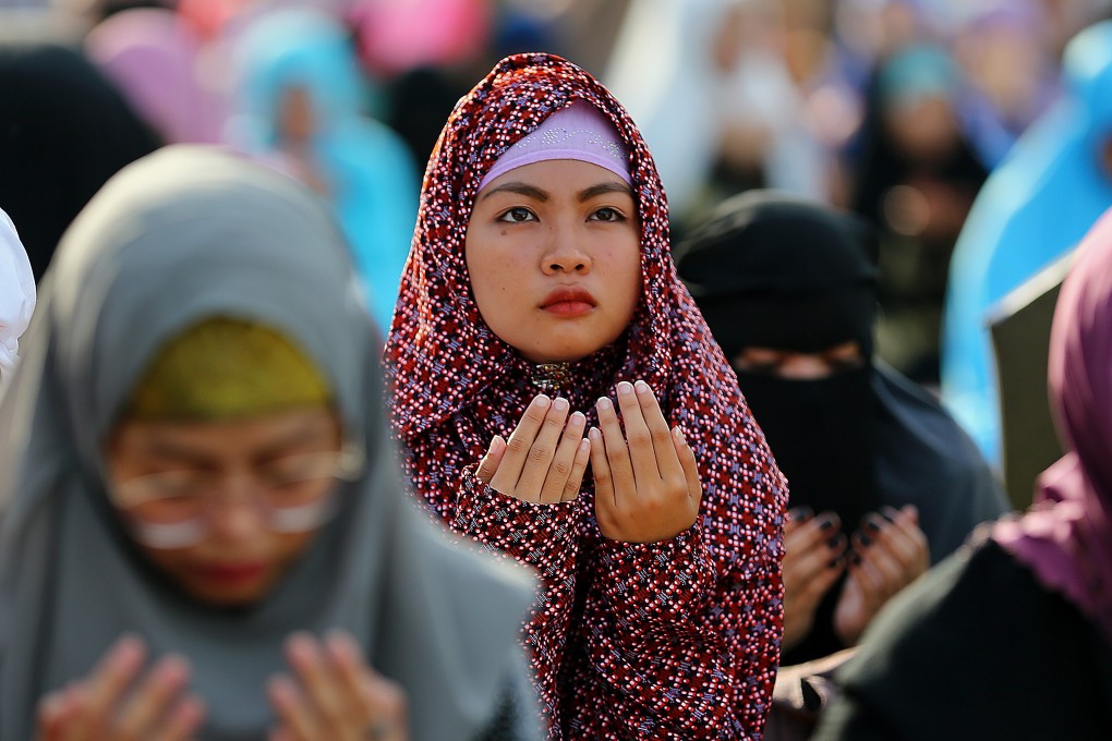 Muslim women attend Eid prayers in Quezon City, the Philippines. Photo: Xinhua
