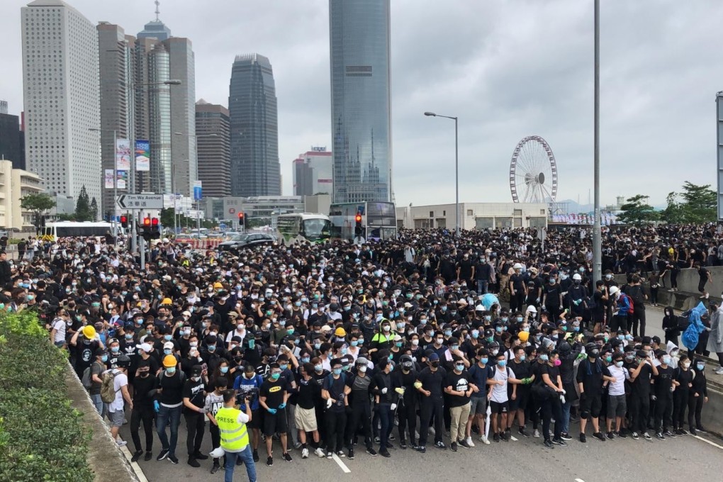 Demonstrators block Lung Wo Road in Admiralty in Hong Kong as part of a protest against the government’s contentious extradition bill. Photo: K.Y. Cheng