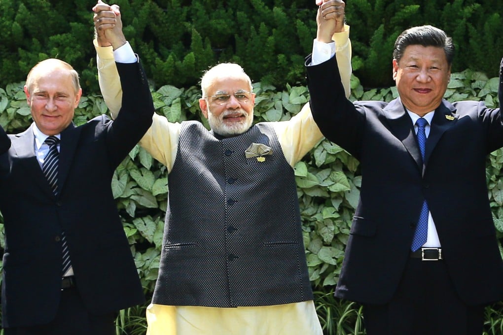Vladimir Putin, Narendra Modi and Xi Jinping at a summit in India in 2016. Photo: AP