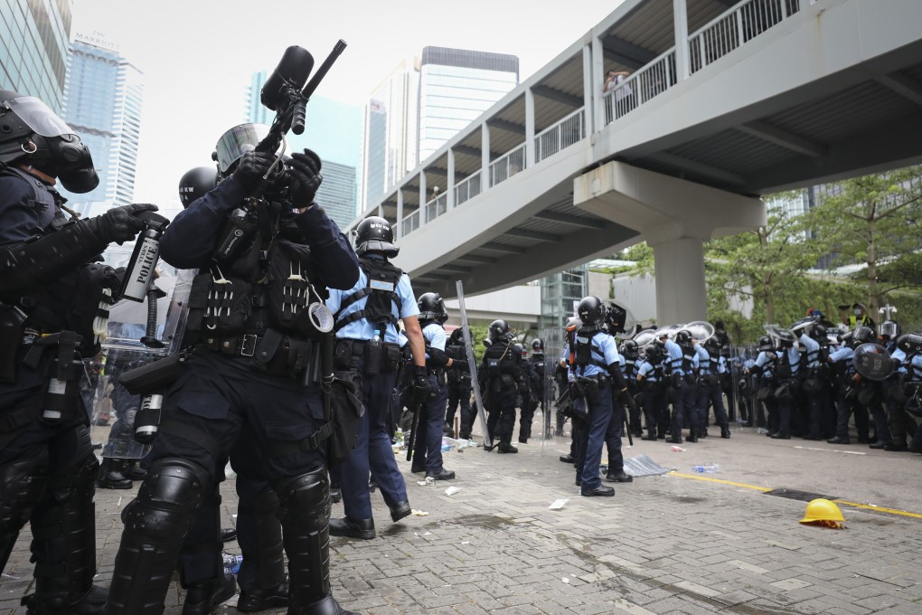 Police and protesters clash in Admiralty, Hong Kong. Photo: James Wendlinger