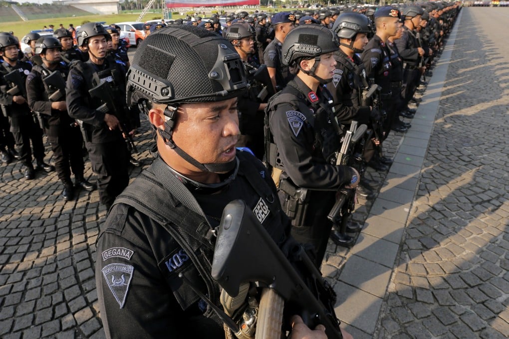 Police officers stand at attention in Jakarta, Indonesia, on May 28. Photo: AP