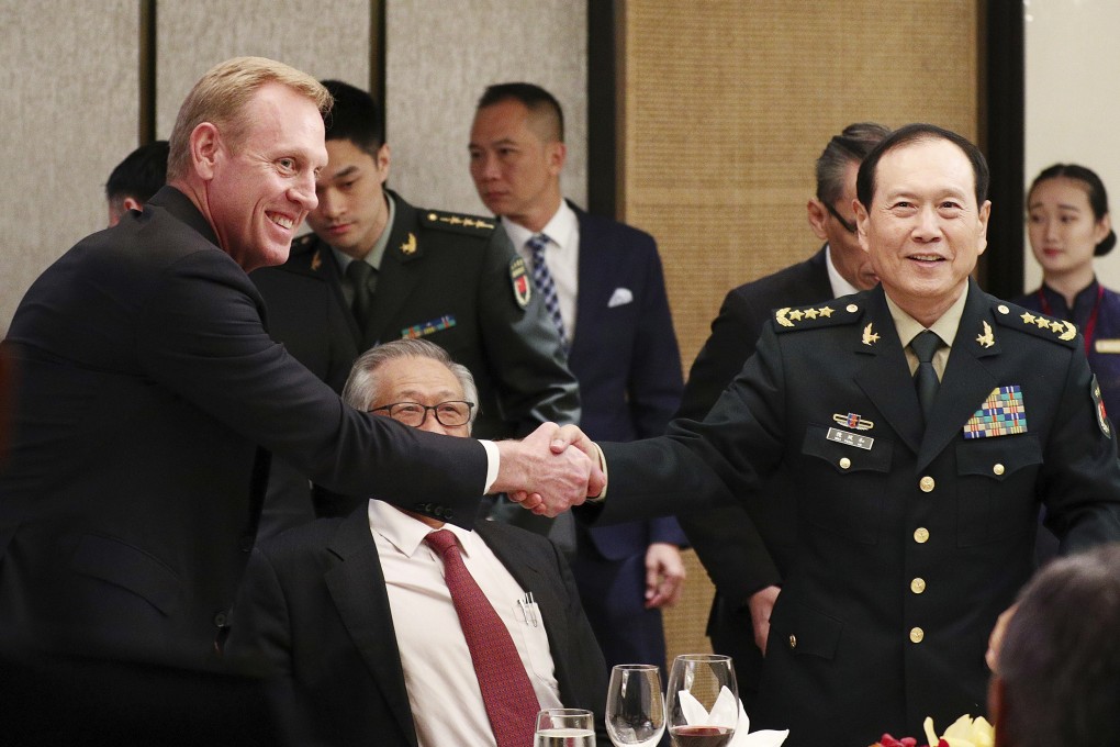 Acting US defence secretary Patrick Shanahan shakes hands with China’d Defence Minister Wei Fenghe on the sidelines of the Shangri-La Dialogue in Singapore. Photo: AP