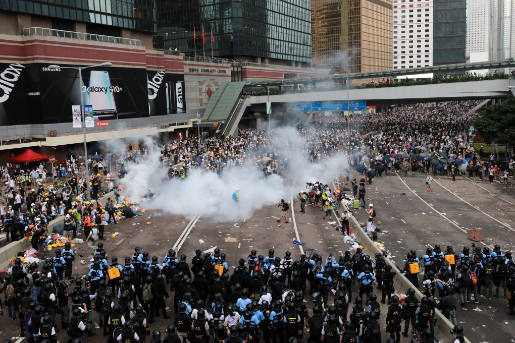 Police use tear gas against the anti-extradition protesters on Harcourt Road in Admiralty on Wednesday. Photo: May Tse