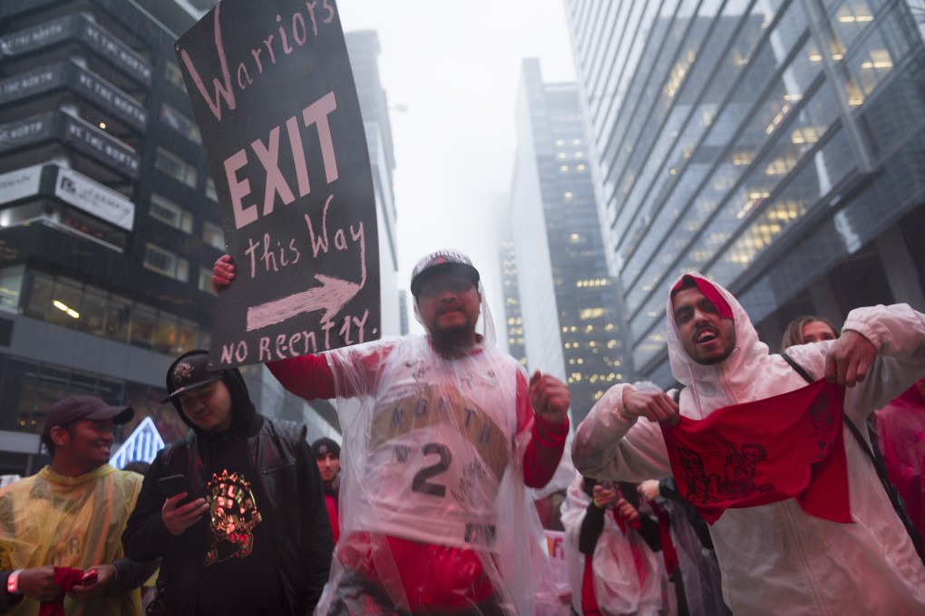 Trash-talking Canada-style from Toronto Raptors supporters at the Jurassic Park fan zone. Photo: EPA