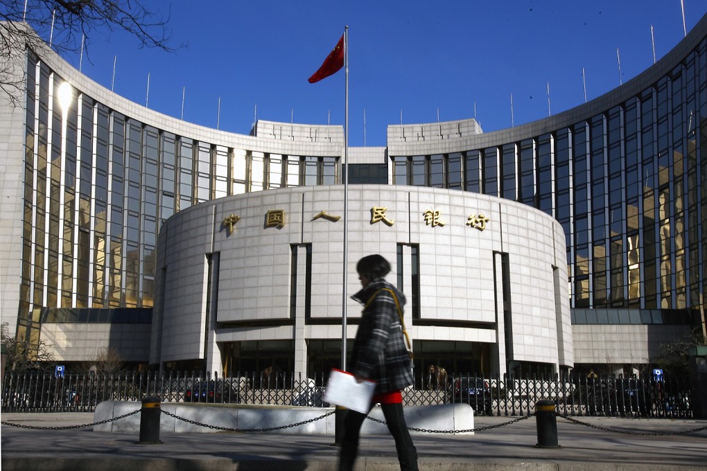 The People’s Bank of China is supporting a trial scheme to be based in Shanghai that will remove ownership limits in firms in companies providing securities and fund management services. Photo: Xinhua