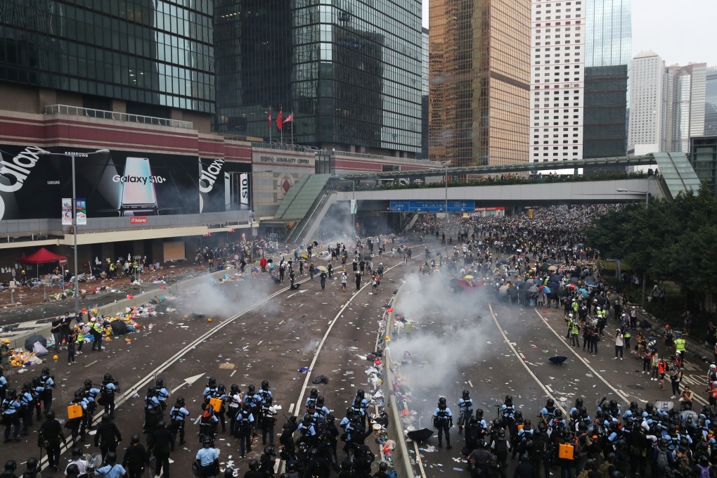 Anti-riot police officers clash with anti-extradition protesters in Admiralty on Wednesday. Experts say the legislation could potentially damage the city’s economy and its relationship with the US. Photo: Sam Tsang