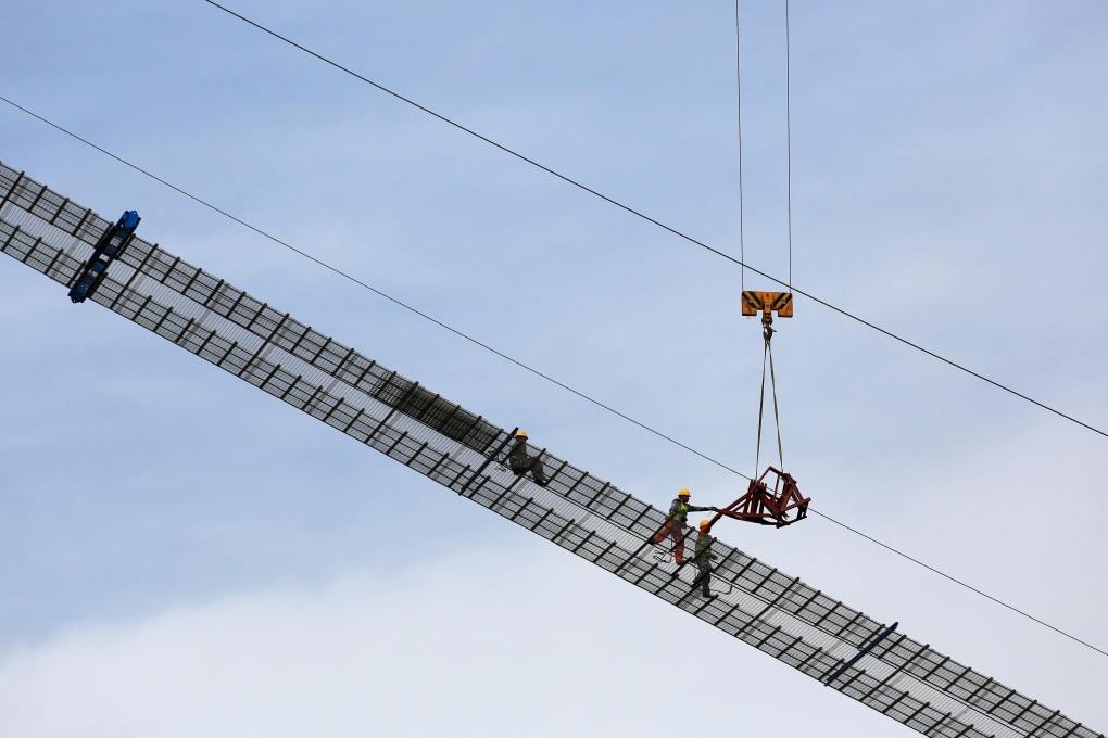Workers are seen at the construction site of Panggong bridge over the Han river in Xiangyang, Hubei province, China on May 8. The focus of China’s recent stimulus is on infrastructure. Photo: Reuters
