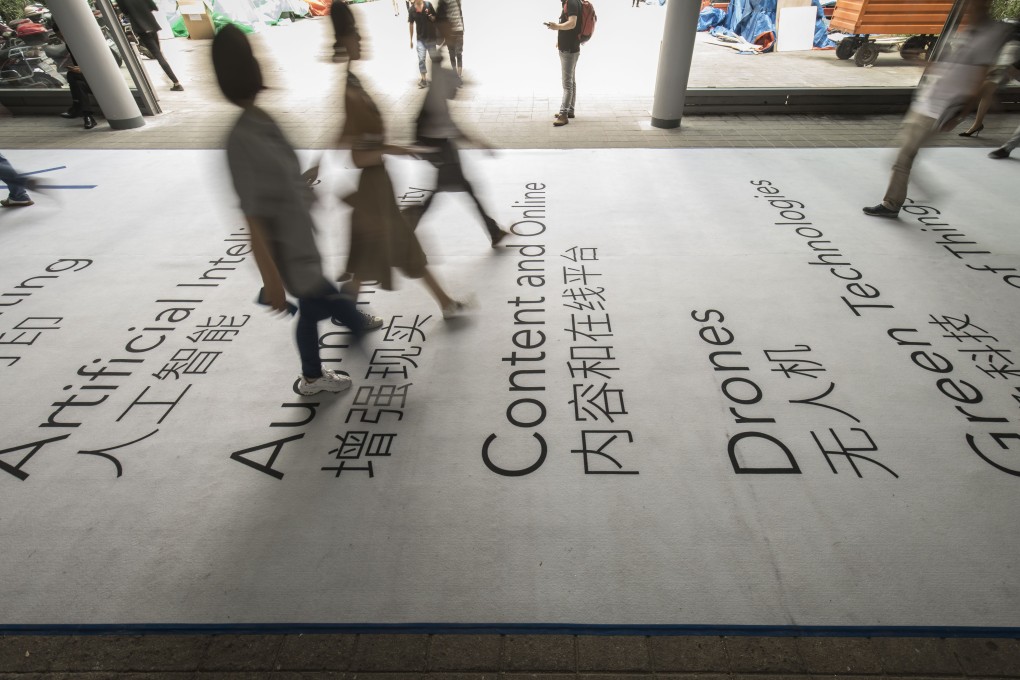 Attendees walk through the CES Asia 2019 trade show, which was held in Shanghai from June 11 to 13. Photo: Bloomberg
