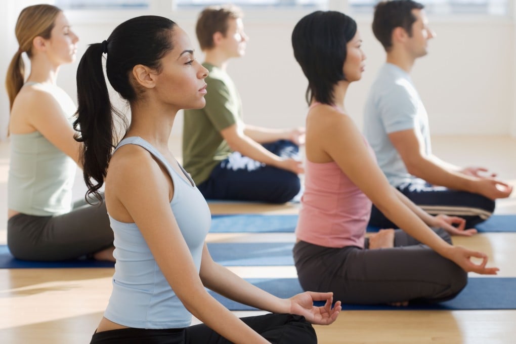 Find your balance at the Evolution Annual Asia Yoga Conference in Hong Kong. Photo: Alamy