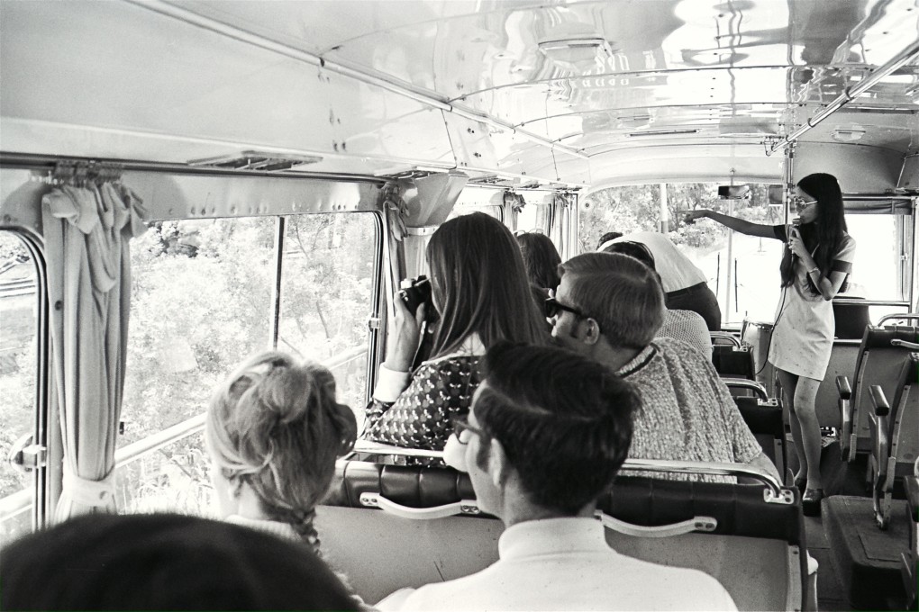 A tourist guide with a busload of tourists in 1970s Hong Kong. Picture: SCMP