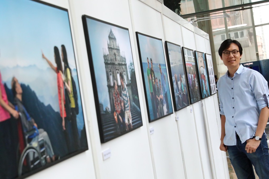 Photographer Dick Lau with some of the pictures that feature in his Return series. Photo: Felix Wong