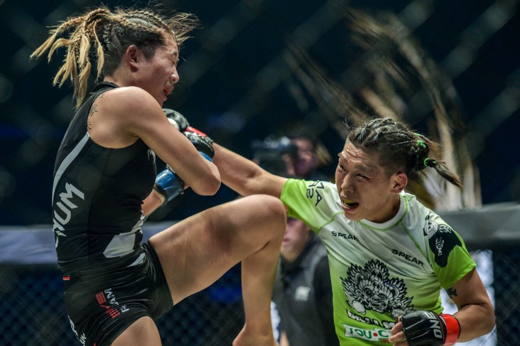 Xiong Jingnan lands a punch on Angela Lee during their world strawweight title fight in Tokyo. Photo: One Championship