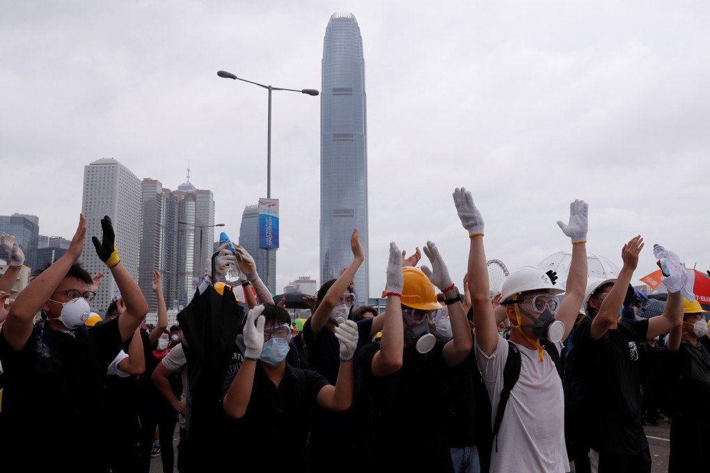 Protesters react during a demonstration against the extradition bill, in Admiralty on June 12, 2019. Photo: Reuters