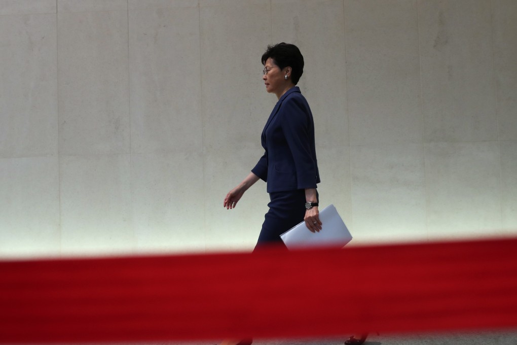 Chief Executive Carrie Lam Cheng Yuet-ngor (centre) heads to a press conference on June 10 at the government headquarters in Tamar, Admiralty, on Sunday’s mass protest against the extradition bill. Photo: Robert Ng