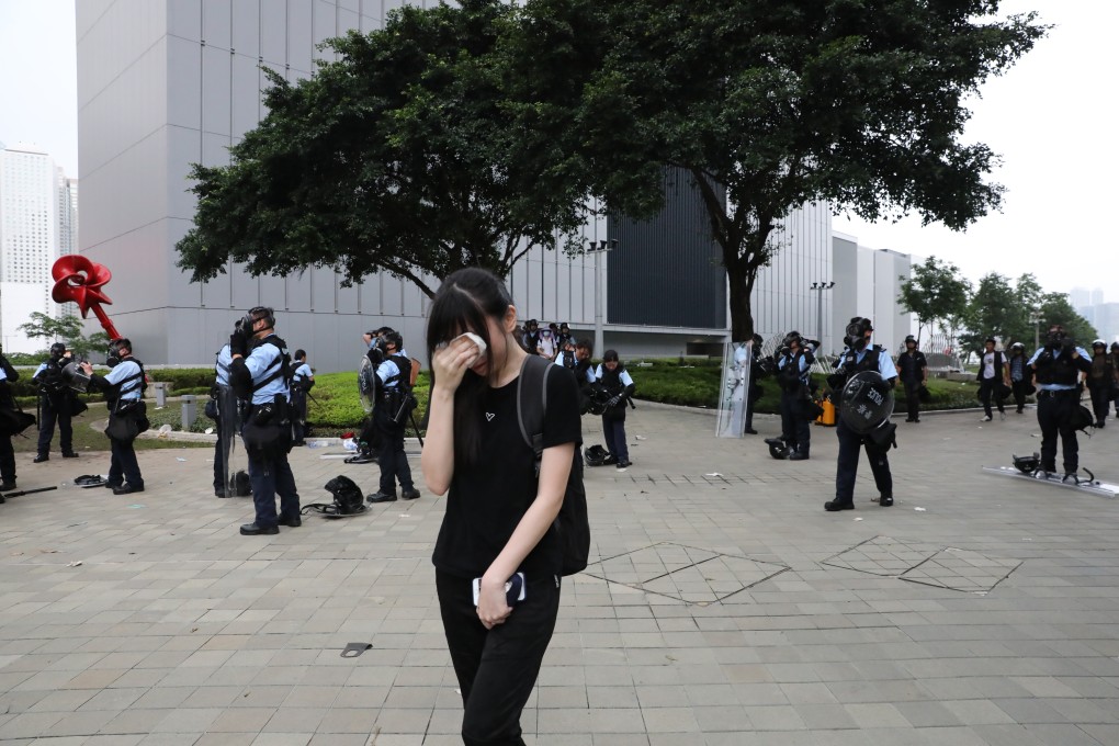 A protester suffers outside the Legislative Council complex in Tamar on June 12. Photo: K. Y. Cheng