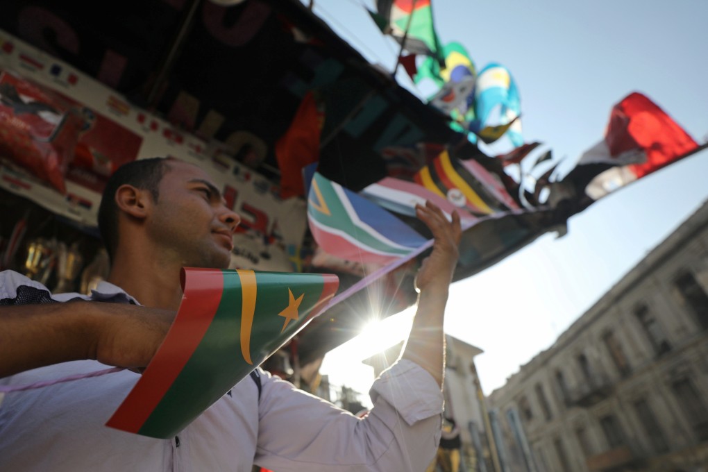 A man sells flags of African countries in Cairo ahead of the Africa Cup of Nations. Photo: Reuters