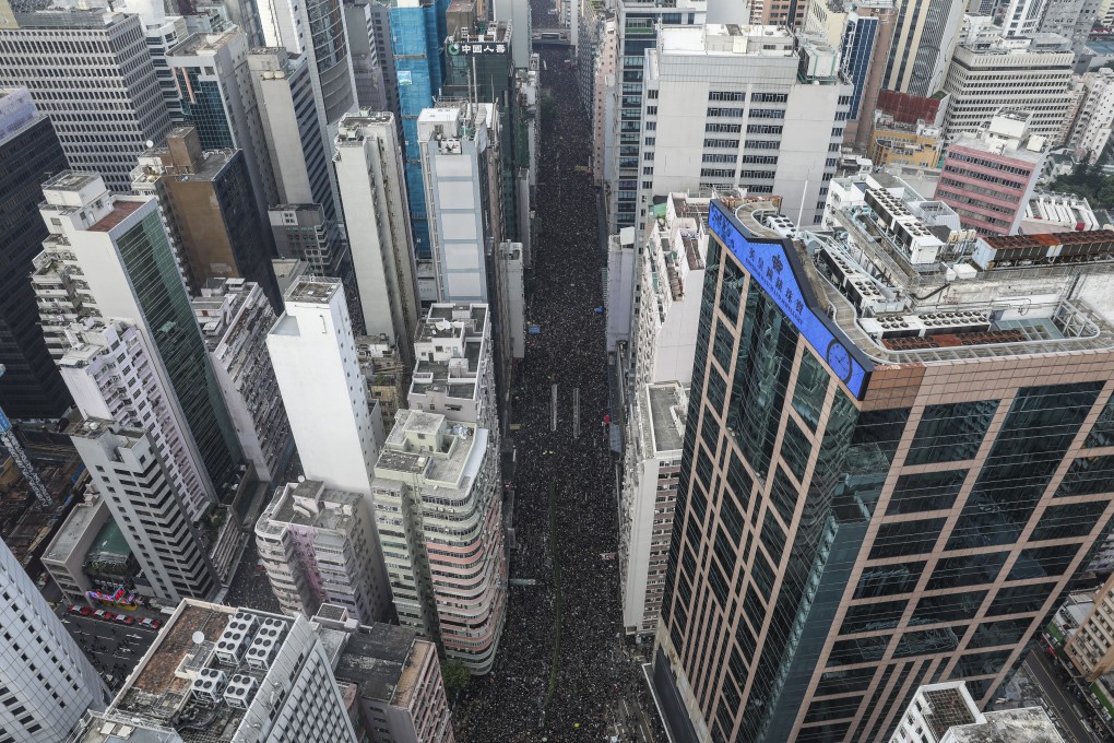 Protesters march from Causeway Bay to the government headquarters in Tamar, Admiralty, on June 16, against the extradition bill, calling on Hong Kong’s leader to resign and to drop the categorisation of the events of June 13 as a riot. Photo: Robert Ng