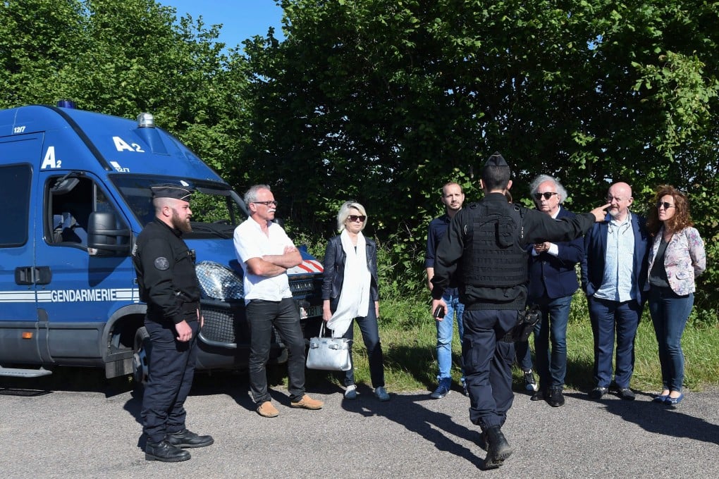 Relatives of Alexia Daval take part in the re-enactment of her murder near Esmoulins, eastern France, on Monday. Photo: AFP