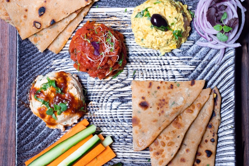 Cardamon Street’s mezze platter is served with pita bread flavoured with spices like rosemary.