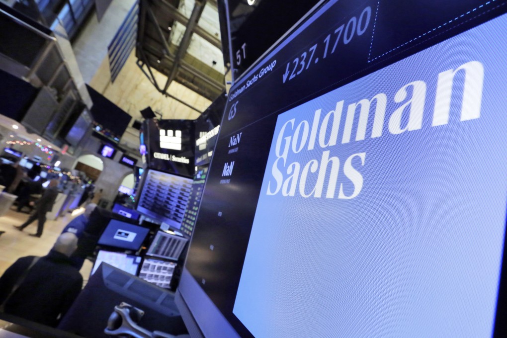 The logo for Goldman Sachs appears above a trading post on the floor of the New York Stock Exchange. Photo: AP