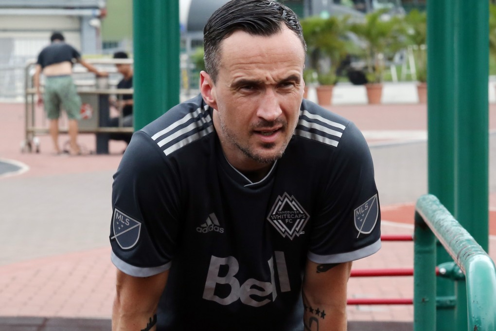 Patrick Blennerhassett recovering from a run at the Happy Valley Racecourse sports track. Photo: Jonathan Wong