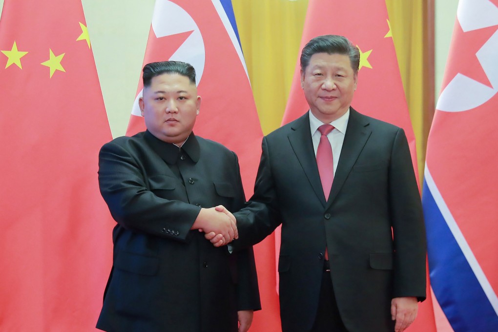 North Korea’s leader Kim Jong-un shakes hands with China’s President Xi Jinping during a welcome ceremony at Beijing’s Great Hall of the People in 2018. Photo: AFP