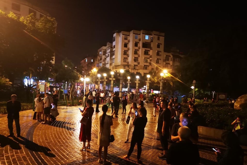 Residents gather in the open in Changning county on Monday night after a magnitude 6.0 hit the area. Photo: Xinhua