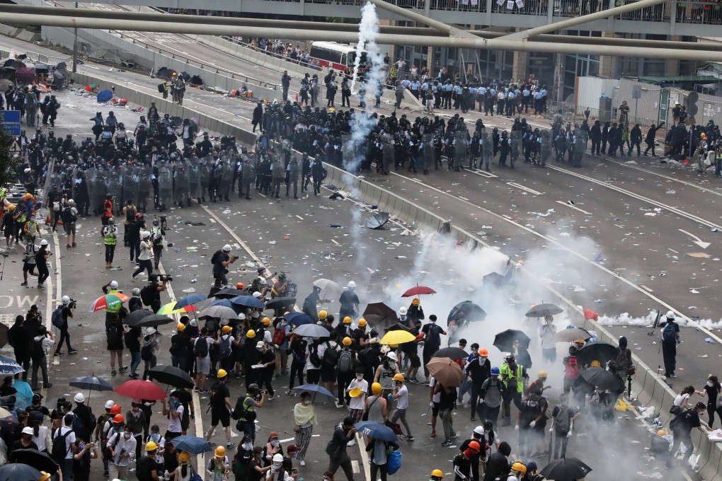 Anti-riot police disperse anti-extradition bill protestors with tear gas on Harcourt Road, Admiralty. Photo: K. Y. Cheng