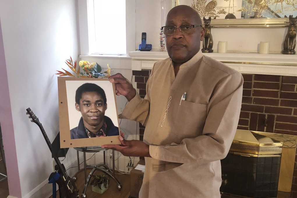 Dia Khafra, father of Askia Khafra, holds a photo of his son in his home in Silver Springs, Maryland, in September. Photo: AP