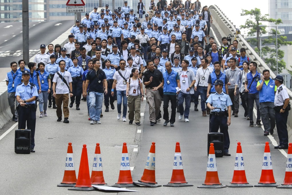 Police arrive to speak with protesters who had remained on the streets overnight in Admiralty. Photo: Edmond So