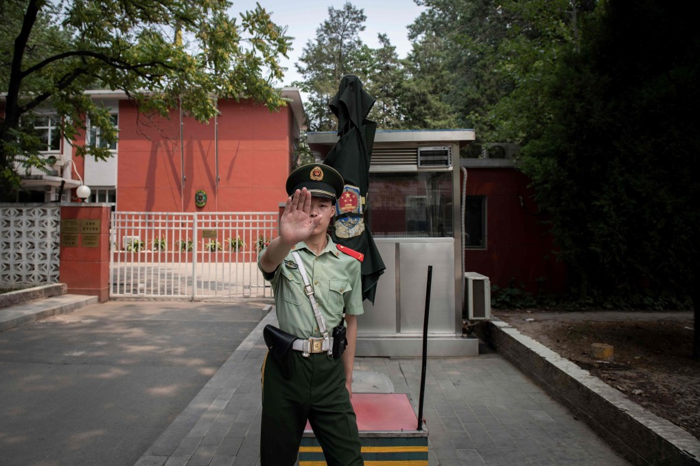 Chinese police escorted the family away from the Belgian embassy in Beijing, pictured, late last month. Photo: AFP