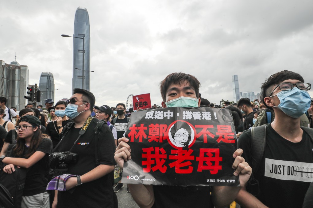 Protesters outside government headquarters in Tamar call for the withdrawal of the extradition bill and city leader Carrie Lam to resign. Photo: Sam Tsang