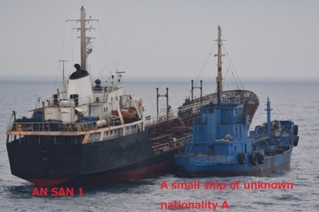 An image released by Japan’s defence ministry purporting to show a small vessel of unknown nationality lying alongside a North Korean-flagged tanker last month in the East China Sea. Photo: Handout