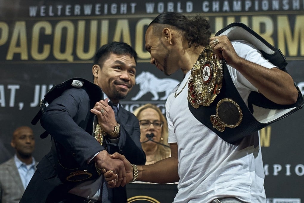 Manny Pacquiao shakes hands with Keith Thurman during their news conference in New York. The two will clash in a welterweight world championship bout on July 20 in Las Vegas. Photo: AP