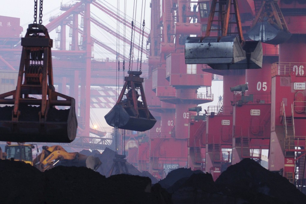 Imported iron ore being unloaded at Rizhao Port in eastern China’s Shandong province. Photo: AP